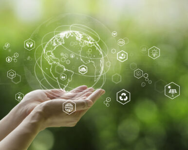 Sustainable development goal (SDGs) concept.Hands holding Global communication network with Environment icon on a green background.Green technology and Environmental technology.ESG